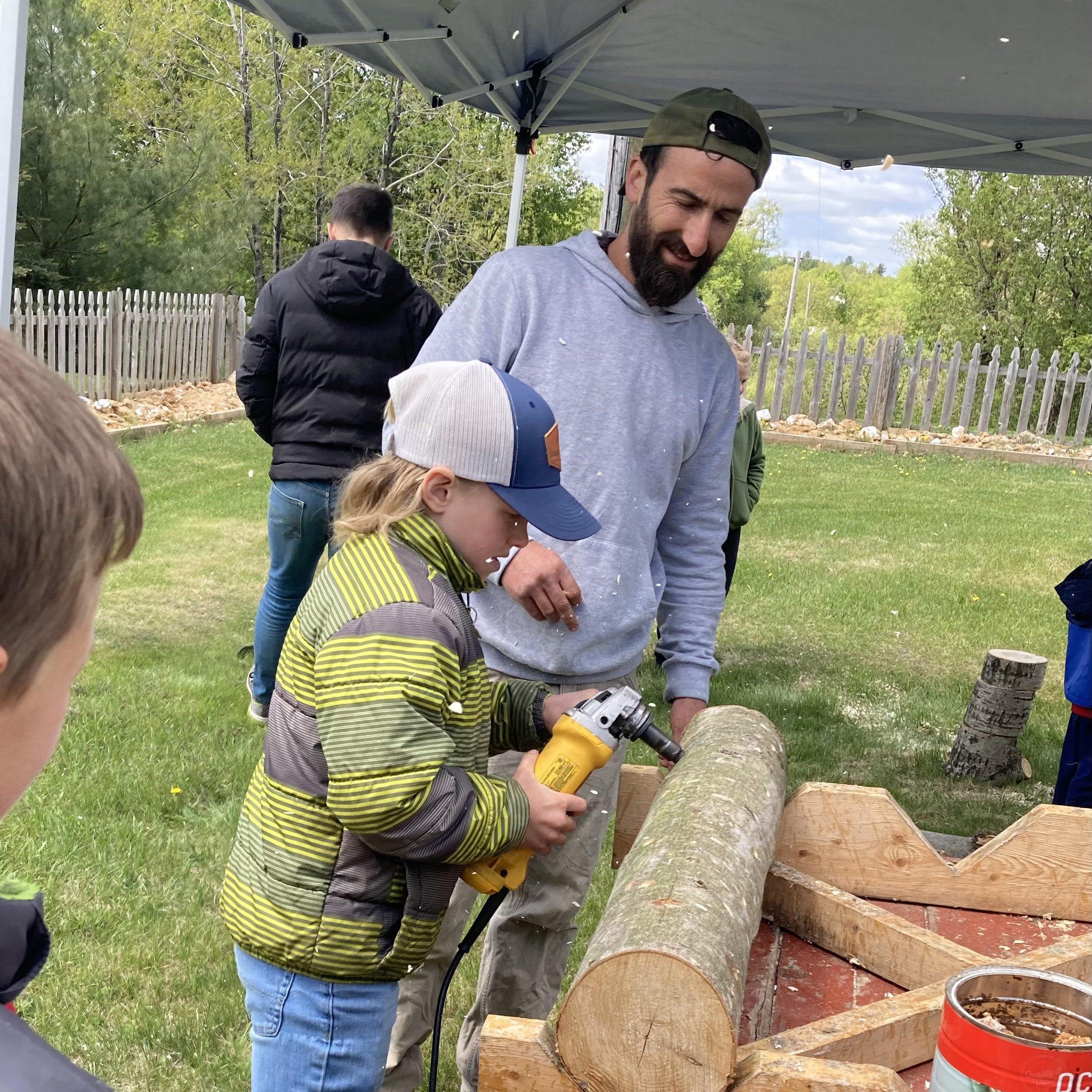 Liam Carney and child growing mushrooms