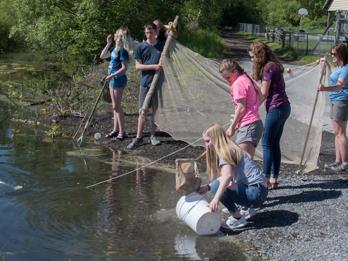 teens monitoring the lake's water quality