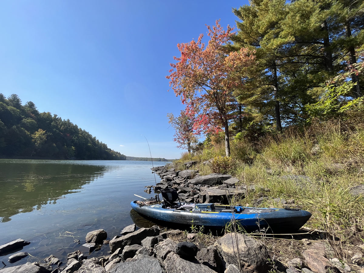 lake shore with kayak outfitter for fishing