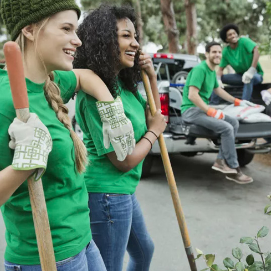 teens work on a nature preserve near a lake