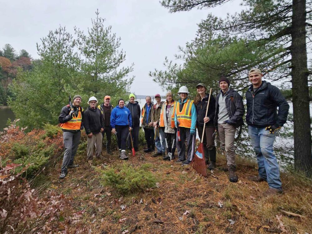 a group of volunteers doing trail maintenance