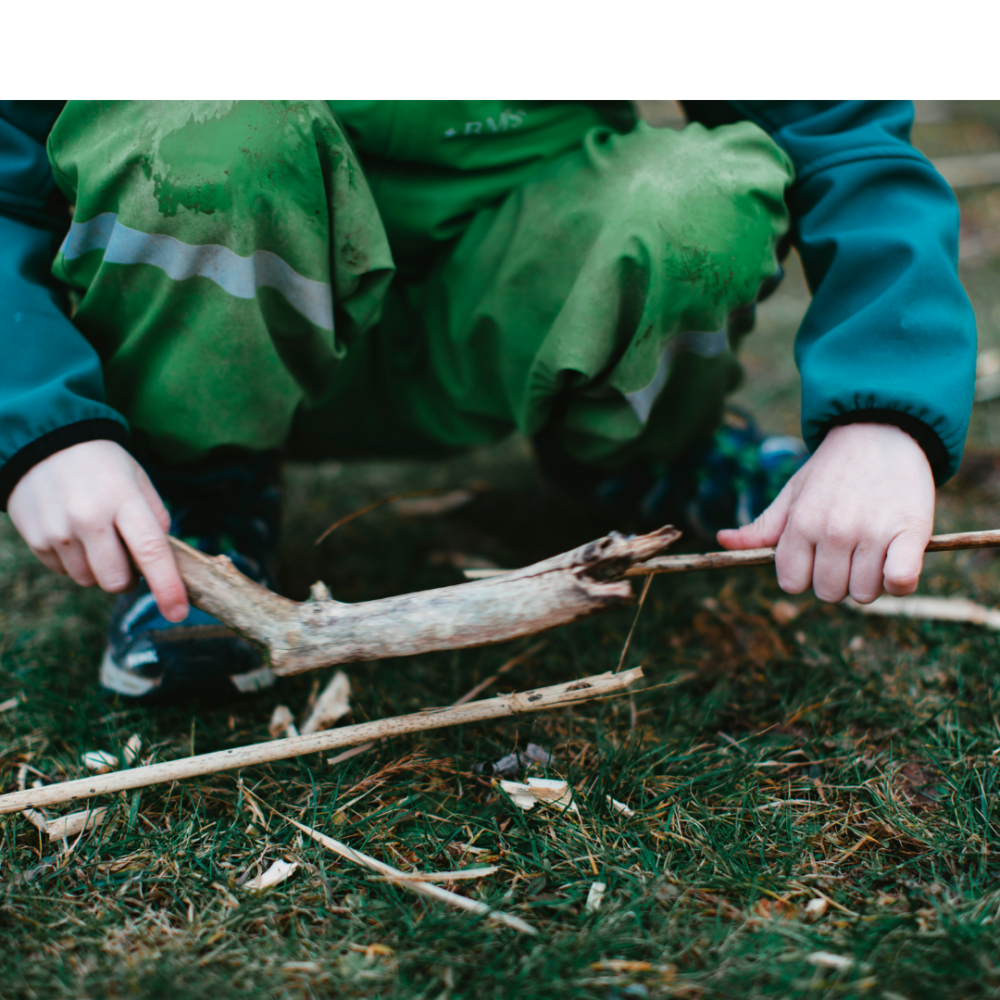 Stick Breaker Child breaking sticks in dirt