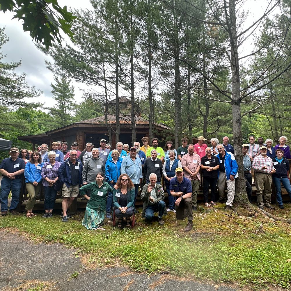 Attendees of the 2024 Water Quality Conference posing in front of the learning center